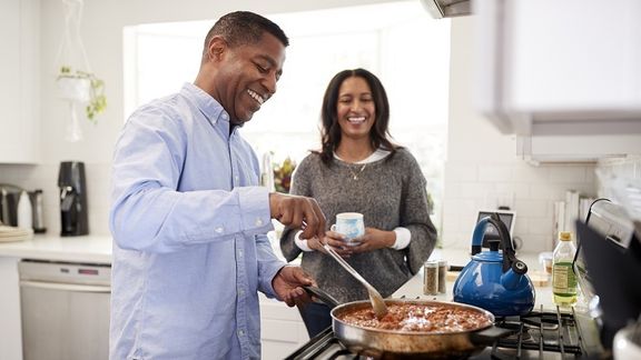 Man and woman cooking for healthy gastro intestinal health