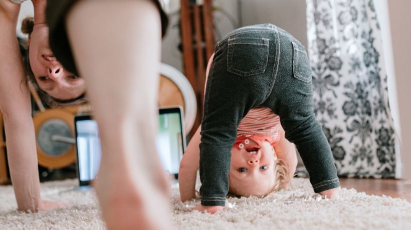 Pediatric age toddler doing yoga